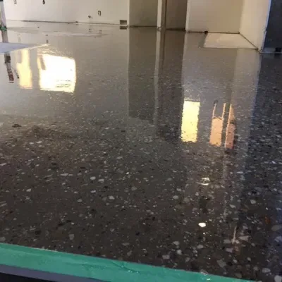 Detailed view of freshly acid stained concrete floor in Waukesha with reflective finish and texture