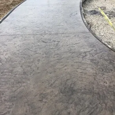 Affordable concrete walkway providing a smooth and durable path for outdoor spaces in residential areas