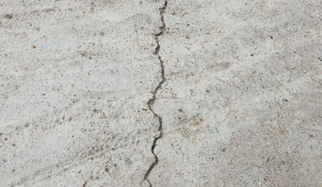 concrete driveway cracks causes