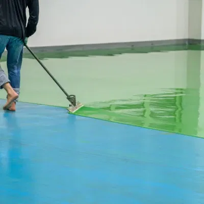 Concrete floor protection work in West Allis, WI with green coating application process