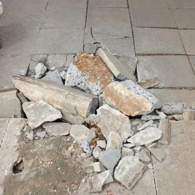 Broken concrete steps and walkway in Sussex, Wisconsin require repair and maintenance for safety and accessibility