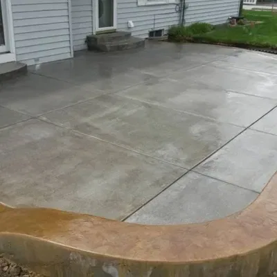Custom colored concrete project in Waukesha showcasing a unique patio design