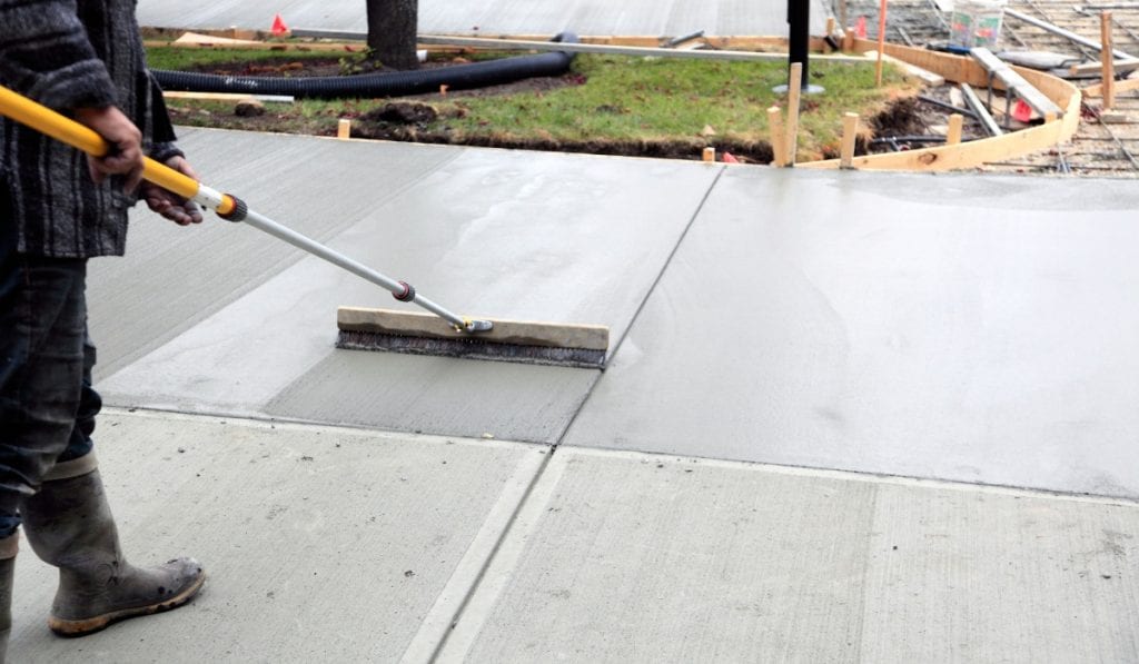 Expansion joint between sections of a concrete driveway