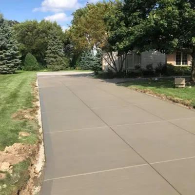 Driveway concrete installation taking place in Waukesha with smooth surface preparation