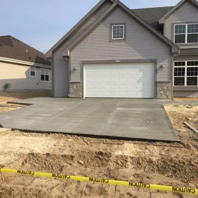 Concrete driveway installation process for residential property in suburban area