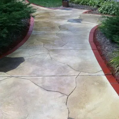 Durable floor coating showcased in a landscaped pathway in West Allis, WI during sunny weather