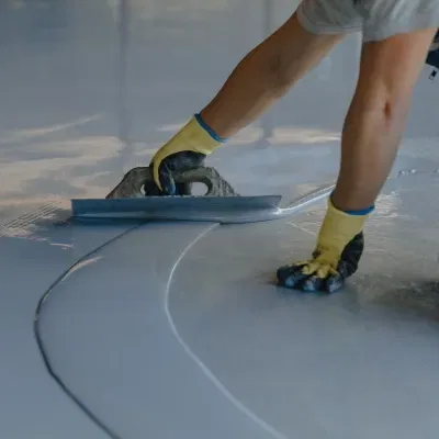 Expertly applying high gloss epoxy finish in Pewaukee WI for a durable and attractive surface