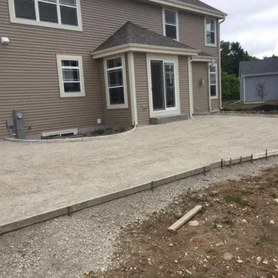 Concrete sidewalk pouring in Waukesha for residential property construction project