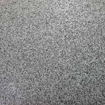 Close-up view of a textured gray surface with speckles ideal for design and decor purposes in modern interiors