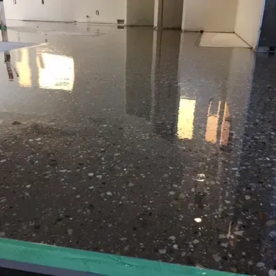 Detailed view of freshly acid stained concrete floor in Waukesha with reflective finish and texture