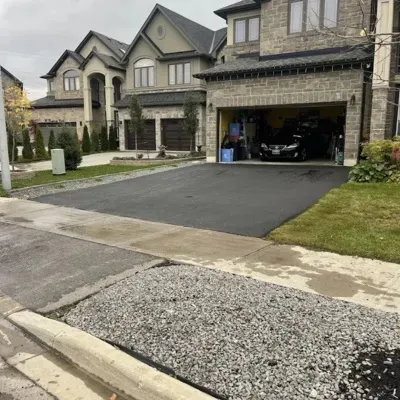 Concrete demolition service in Waukesha for driveway and landscaping enhancement near residential area