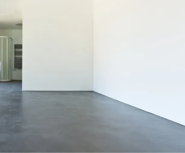 Beautiful concrete floor in modern Wauwatosa interior showcasing polished minimalist design and natural lighting