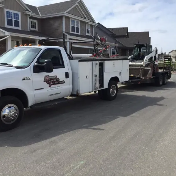 Concrete demolition equipment ready for work at a residential site in Waukesha during clear weather