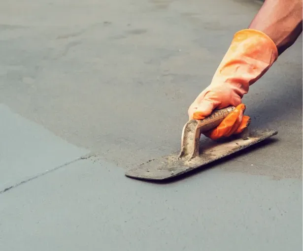 Concrete floor repair process in Wauwatosa involving skilled labor and specialized tools