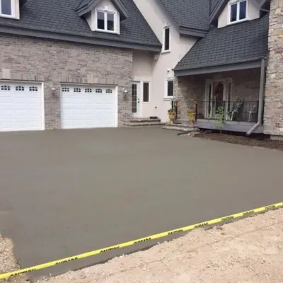 Concrete garage floor installation in Brookfield WI completed with smooth finish and caution tape setup