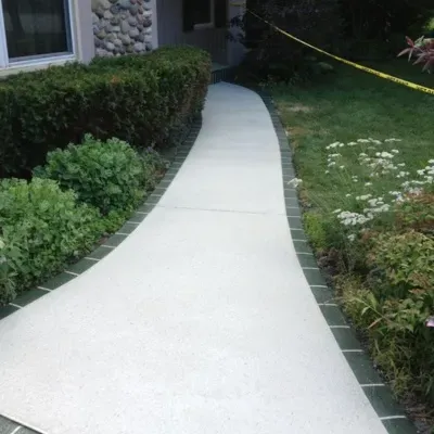 Concrete walkways and steps enhance outdoor space in Delafield, WI with professional installation in Pewaukee, WI