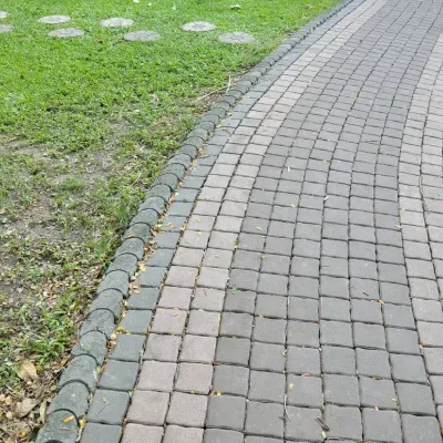 Decorative pathway winding through lush greenery in Sussex, WI invites leisurely strolls and peaceful walks