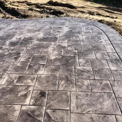 Decorative stamped concrete installation in Waukesha showcases intricate patterns and textures