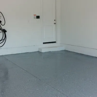 High gloss flooring installation in Sussex WI garage area with a clean and modern appearance