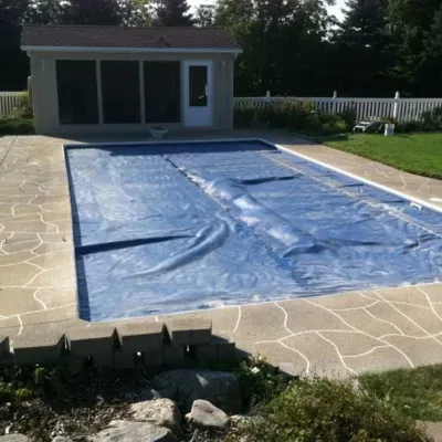 Concrete pouring for pool decking in Waukesha during a sunny day