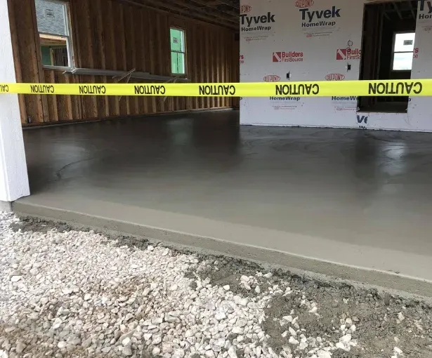 New residential concrete floor installation in West Allis under caution tape