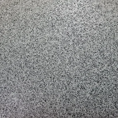 Close-up view of a textured gray surface with speckles ideal for design and decor purposes in modern interiors